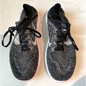 Women’s Nike Free Run Flyknit athletic shoes.